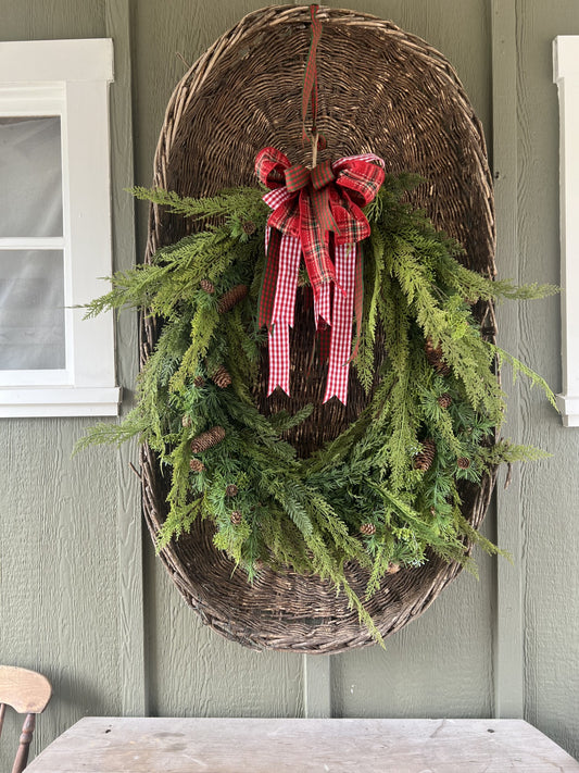 stunning oval cedar and pinecone wreath