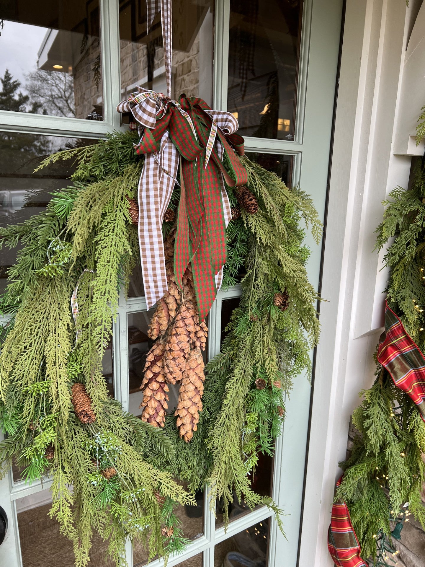 stunning oval cedar and pinecone wreath
